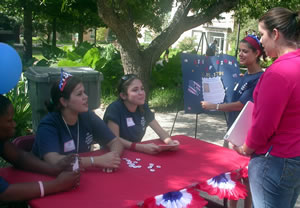 Erika Salinas, Andrea Hinojosa, Teresita De Albacalonje register new voters.